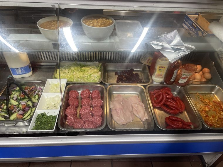 Sandwich fillings laid out in the chilled counter.